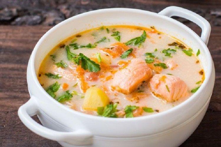 Trout fish soup with melted cheese Trout fish soup with melted cheese